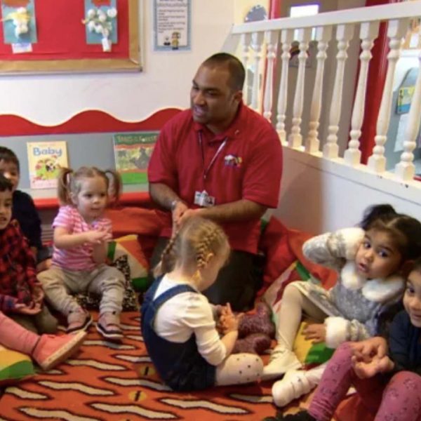 Saief Ahmed reading to children