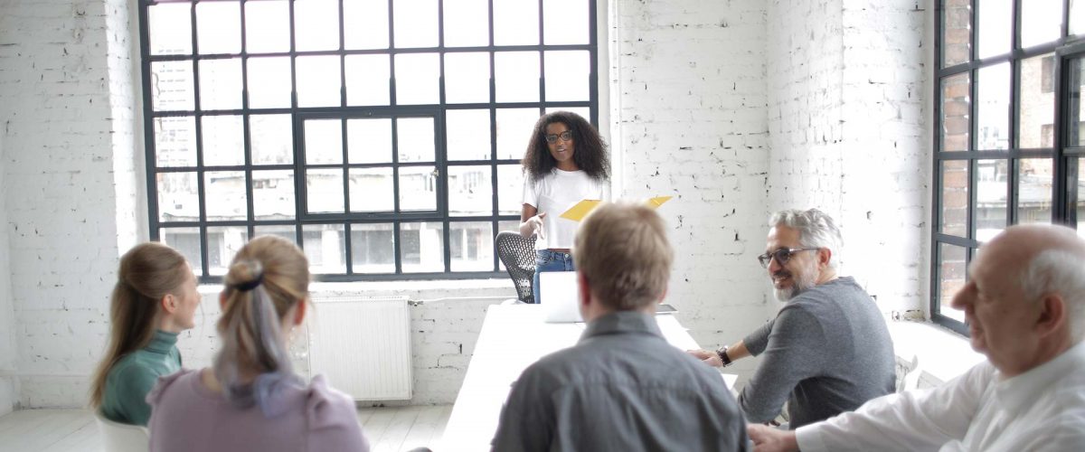 Woman giving a presentation to her colleagues