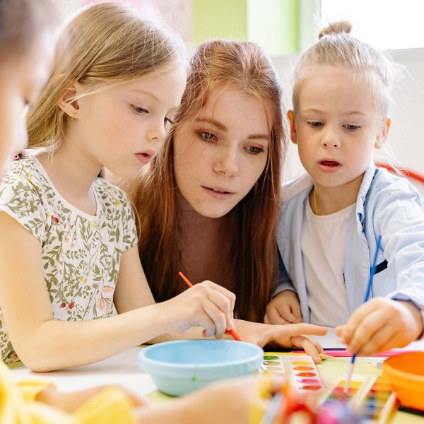 teacher working with children